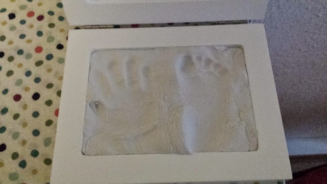 baby handprint and footprint in clay