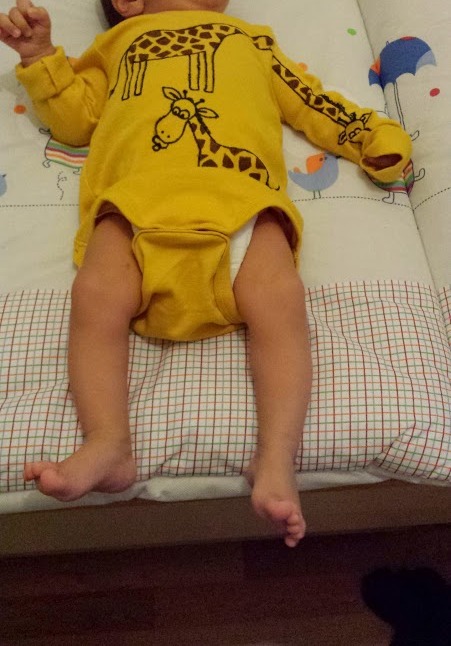baby-wearing-giraffe-romper