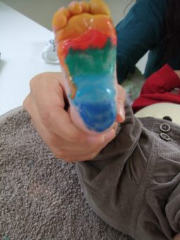 rainbow colors painted baby foot